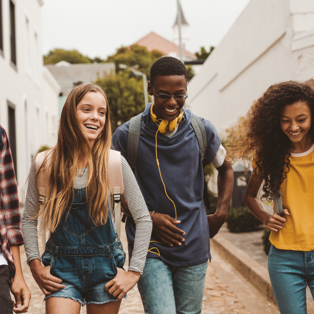 Group of teens hanging on the street